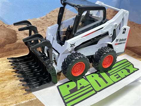 skid-steer loaders toy|toy bobcat skid steer attachments.